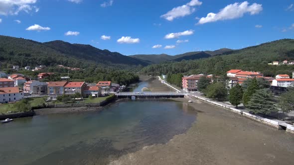 Aerial View Of Bridge Over Rio Maior In Esteiro. Dolly Forward