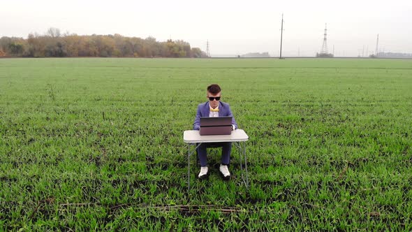 Aerial Top View of Excited Young Startup Businessman Checking Email Reading Great News on Laptop