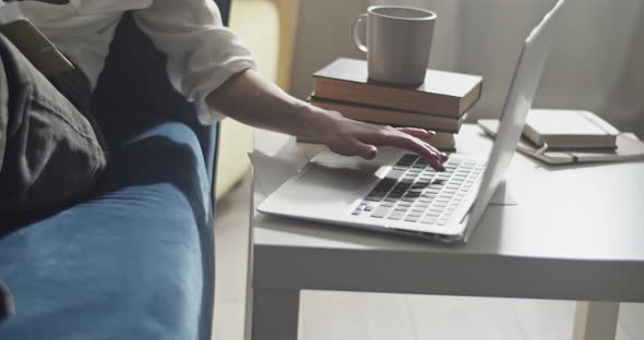 Woman Typing on Laptop and Preparing for Session