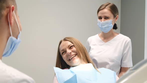 Young Smiling Woman at the Dentist's Reception