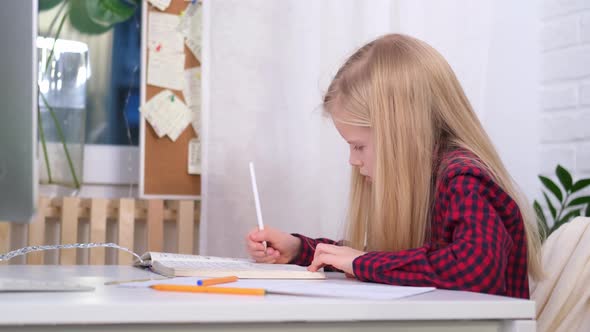 Blonde Schoolgirl Studying at Home Doing School Homework