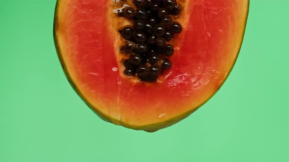 Sweet Papaya Half Isolated on Green Background Chroma Key Fresh Sliced Pawpaw Closeup