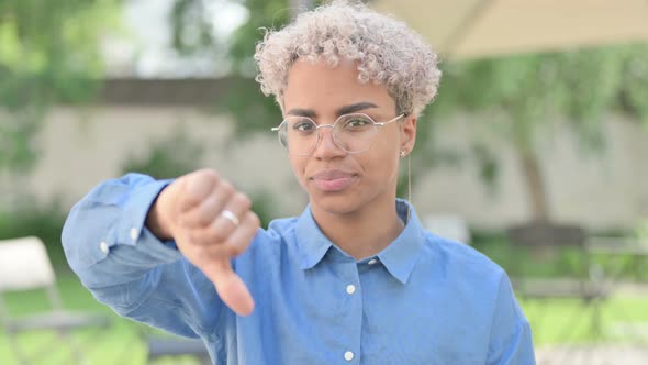 Portrait of Thumbs Down Gesture By Young African Woman