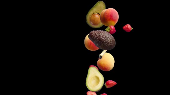 Peach Avocado and Strawberry Fruits Fall on a Black Background