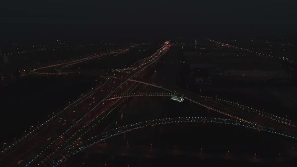 Aerial Top View of Highway Interchange at Night alt