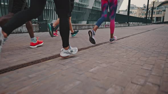 Closeup of Legs of Athletes on a Treadmill