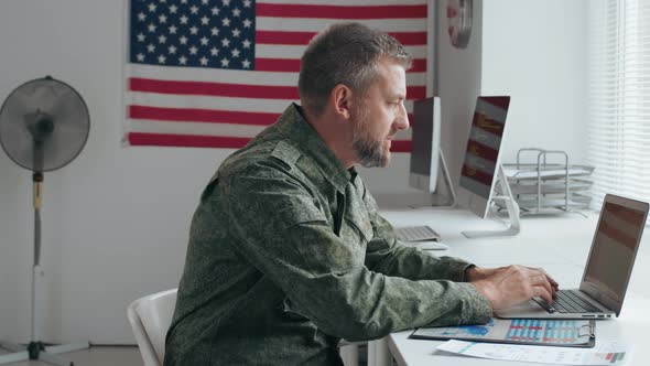 U.S. Army Officer Working on Laptop