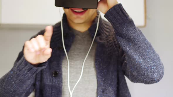 Man using virtual reality headset at home