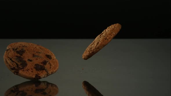 Cookies falling and bouncing in ultra slow motion 1500fps - reflective surface 