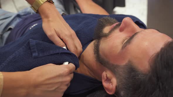 Female Barber Hands Preparing Customer Before Steam Treatment