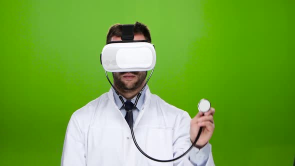 Doctor Wearing Virtual Reality Glasses Conducts Research Stethoscope