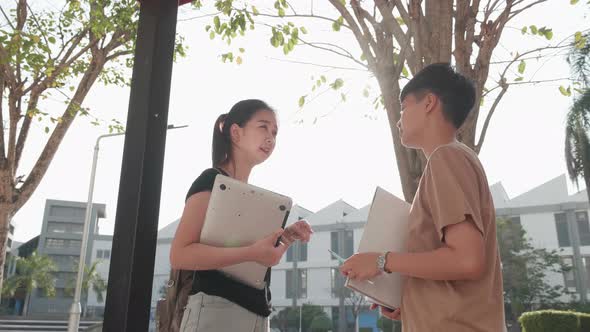 student teenagers talking on walkway. Education and student concept.