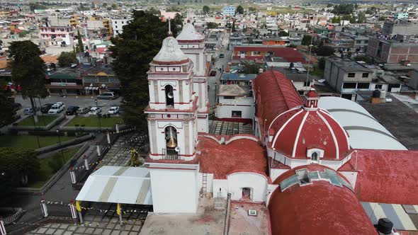 Church in State of Mexico on the day with blue sky and white clouds, cinematic aerial footage with d