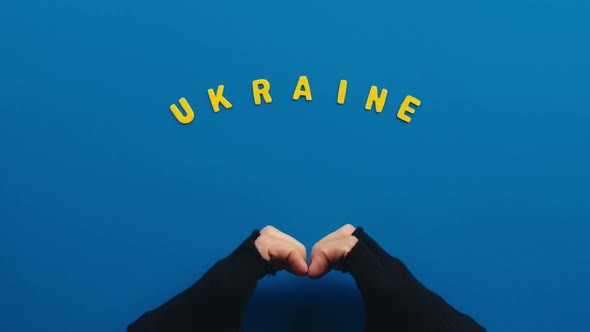 Hand in the Shape of a Heart with Ukrainian Lettering