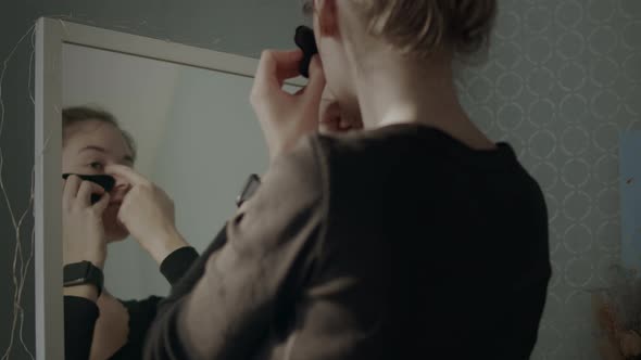 Woman Doing Facial Massage At Home