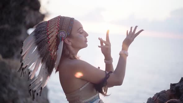 Cinematic Portrait of Majestic Dancing Woman and Sunbeams Wild Shamanic Ceremonial Dress Wearing