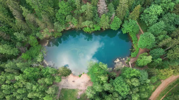 Aerial View of Blue Colored Forest Lake in Poland