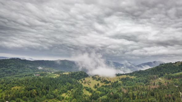 Grey Rainy Clouds over Green Landscape