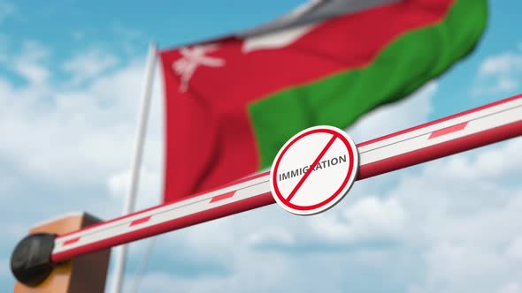 Opening Barrier with Stop Immigration Sign at Flag of Oman