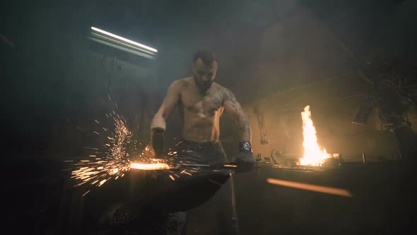 Powerful Blacksmith Strike on Metal