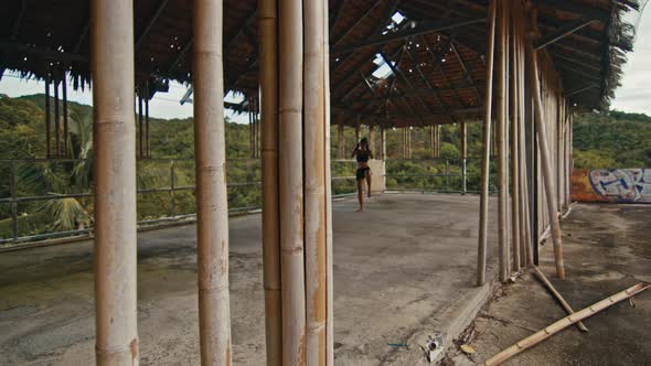 Woman Fighter Trains Her Punches Training Day in the Abandoned Hotel Strength Fit Body