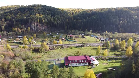 View of a Beautiful Forest Village Village Railway and River Along the Forest Bird's Eye View of the