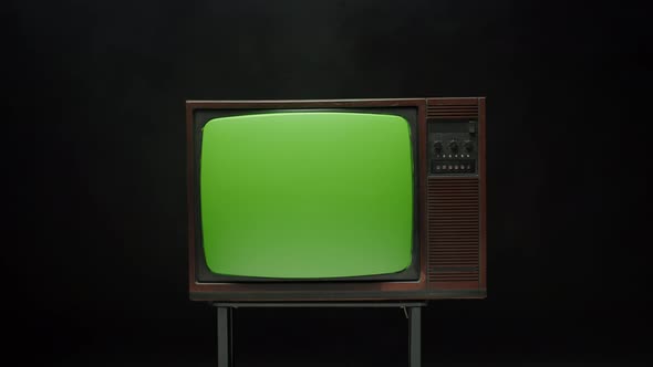 Old Retro Television with Antenna on Grey Background