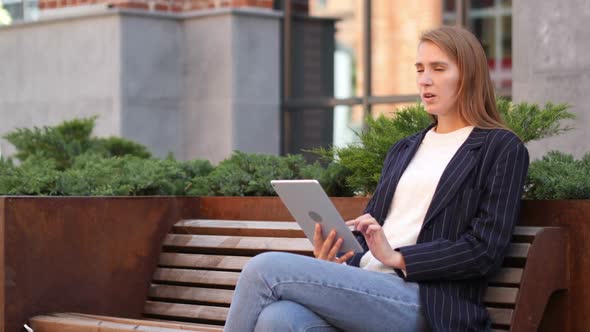 Headache Woman Having Pain in Head While Using Tablet Sitting Outside