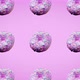 many fresh donuts rotating close-up above a pink bright background - VideoHive Item for Sale