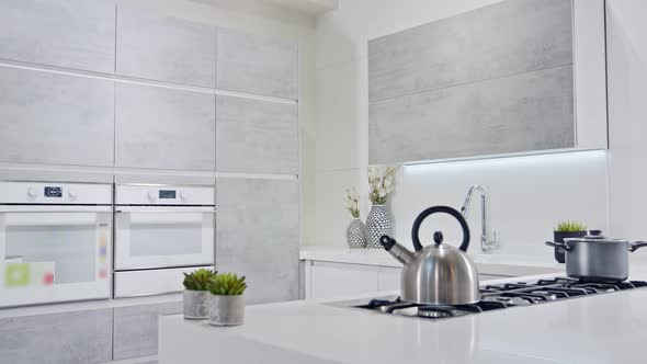 Tracking shot of a luxury kitchen with gray modern design