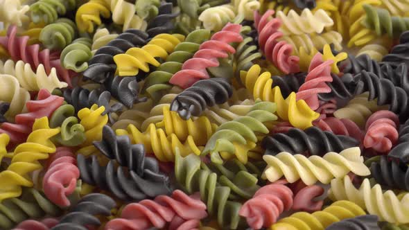 Multicolored raw Italian fusilli pasta