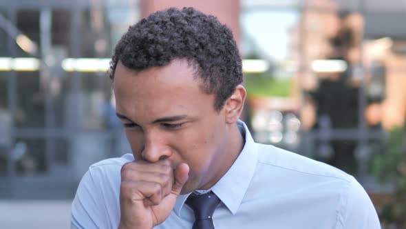 Sick African Businessman Coughing Outdoor