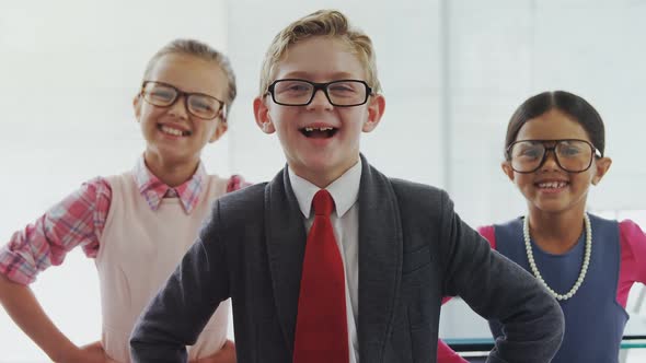 Team of three kids pretending to be executives