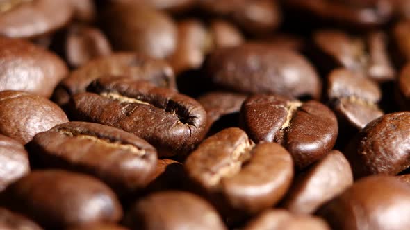 Pile of Roasted Coffee Beans Rotating. Close Up