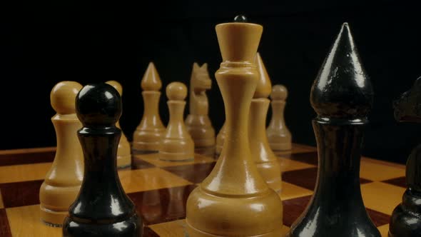 Closeup Dolly Macro Shot of a White Wooden Chess Queen on a Chessboard