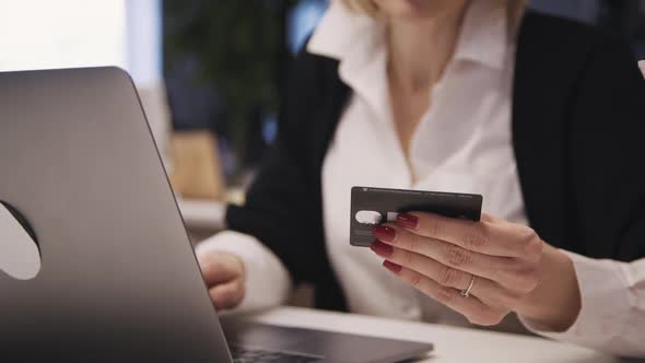 Hands of Woman with Bank or Plastic Card Making Online Shopping