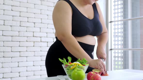 Happy overweight woman enjoy eating healthy food
