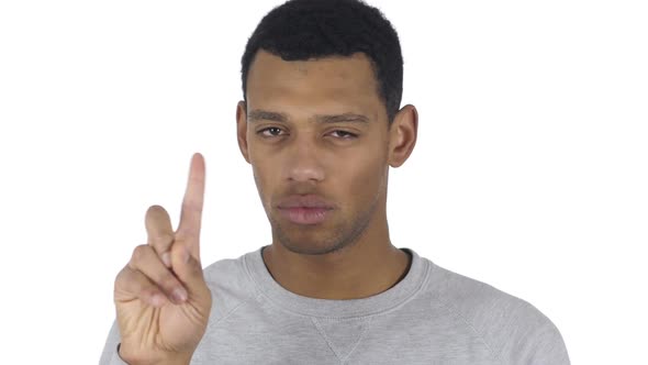 Portrait of AfroAmerican Man Waving Finger to Refuse