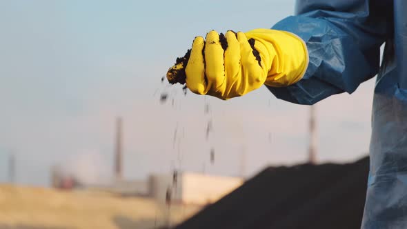 Hand Touching Dirty Soil