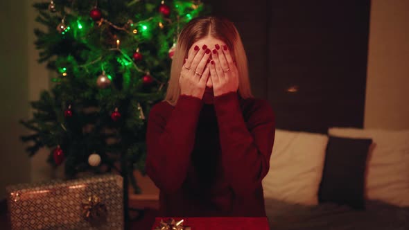 Surprised woman getting Christmas gift