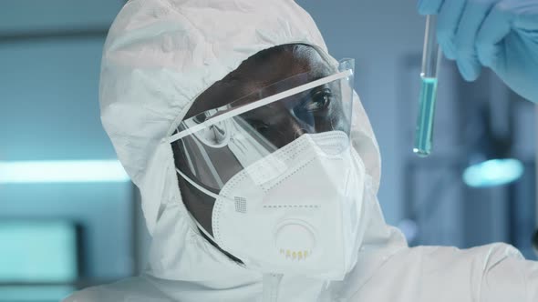 Black Lab Scientist Examining Chemical in Test Tube
