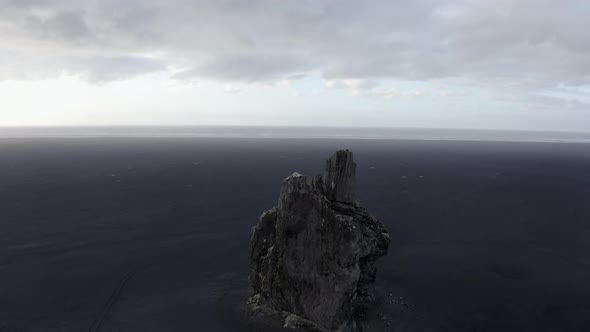 Drone Scenic Shot of Beautiful Rocky Sea Stack and Clear Skies in Iceland