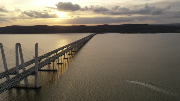 An aerial shot of the Mario M. Cuomo Bridge from the north. The camera dolly out & pan left slowly o