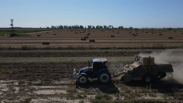 Still Image of Tractor Collecting Peanuts By Digging the Ground