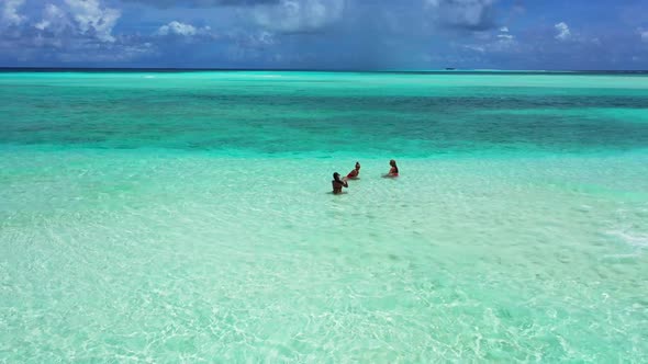 Beautiful ladies look beautiful on tranquil sea view beach lifestyle by aqua blue sea and clean sand