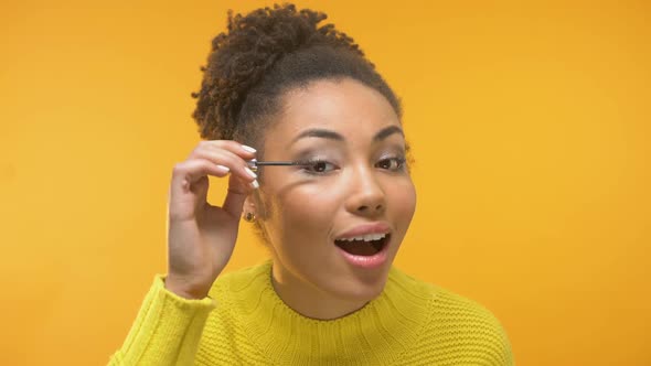 Beautiful Afro-American Lady Applying Eyelash Mascara, Evening Make-Up, Close Up