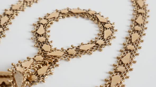 Details of luxurious golden necklace 4K  tilting video