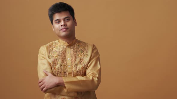 Happy Indian man in national cloth looking at the camera