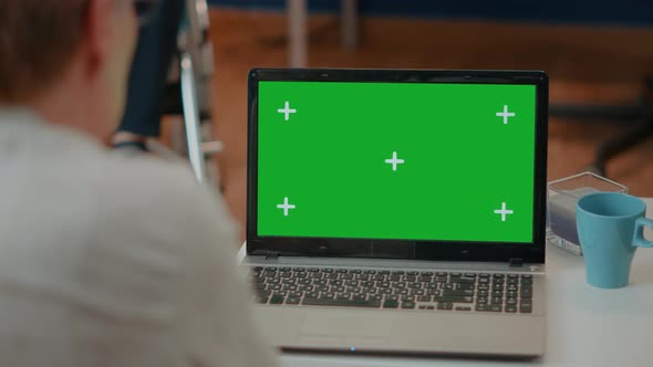 Senior Woman Using Modern Laptop with Green Screen