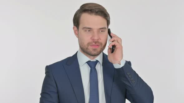 Young Businessman Talking on Phone on White Background